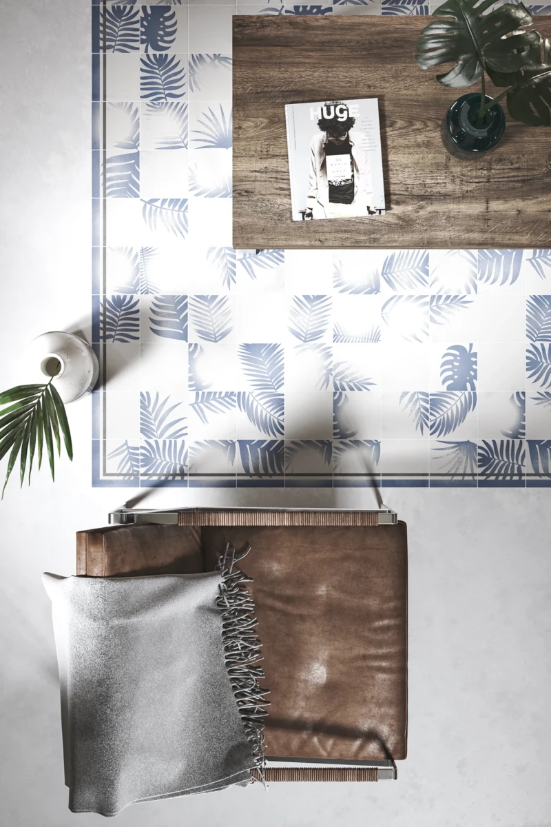 Sol en carreaux de ciment blanc avec un motif en couleur bleue