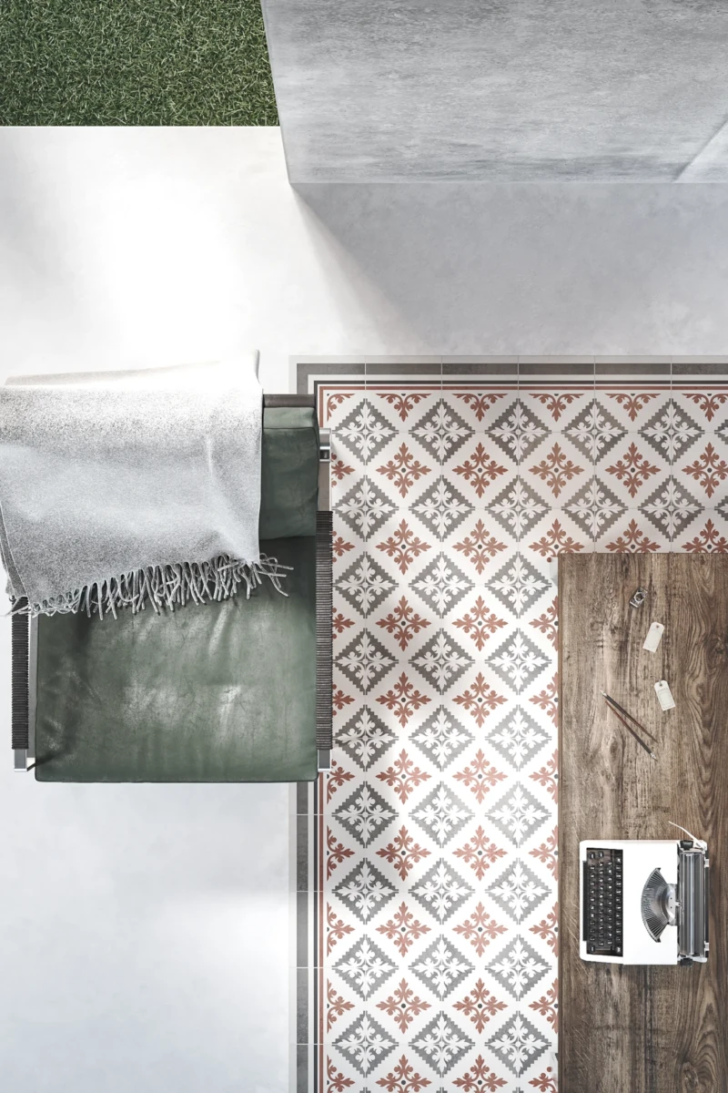 Sol en carreaux artisanaux avec un motif graphique en couleur rouge